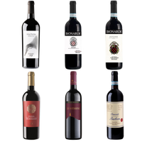 Collection of six wine bottles with various labels on a white background