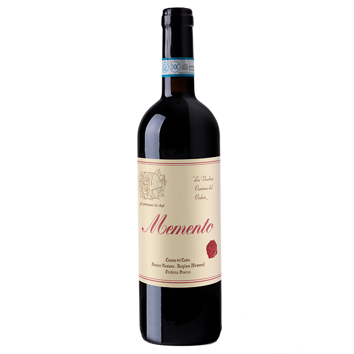 A bottle of red wine labeled 'Memento' with an intense ruby red color, indicating it is a SuperPiemonte blend of Dolcetto and Pinot Noir grapes.